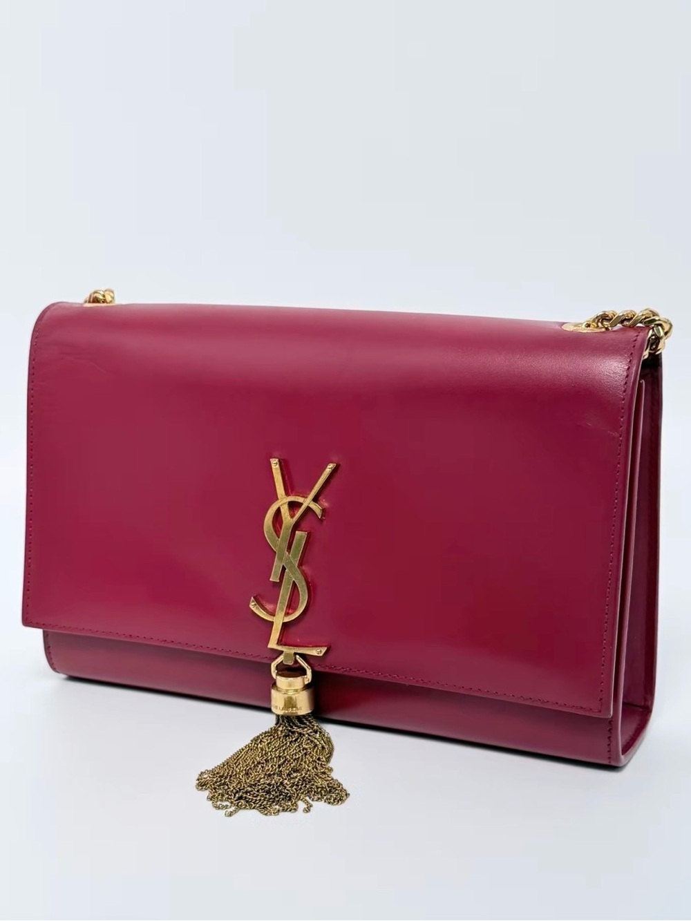 Saint Laurent Burgundy Leather Shoulder Bag with Gold Tassel